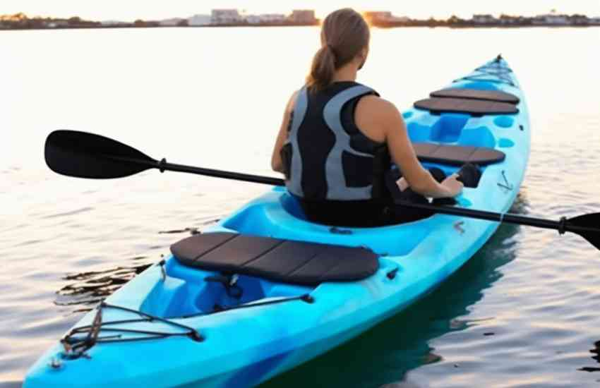 A girl on a sit-on top kayak